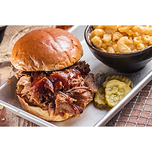 [Select Famous Dave's Locations] Chopped Pork Sandwich w/ Side - $5